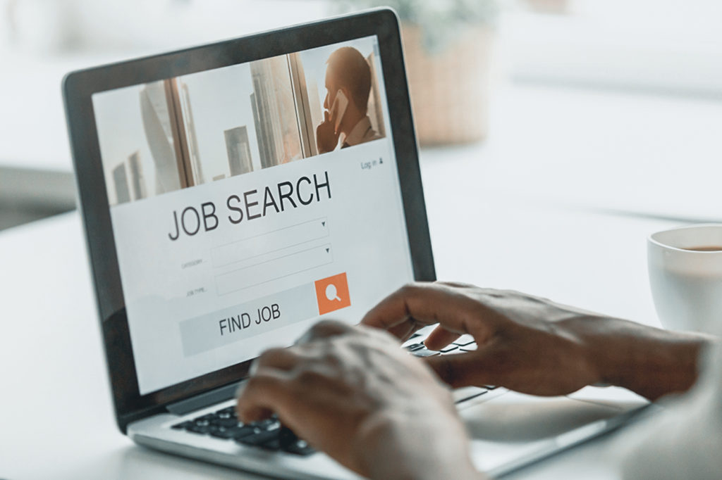 African-american man browsing work online using job search computer app